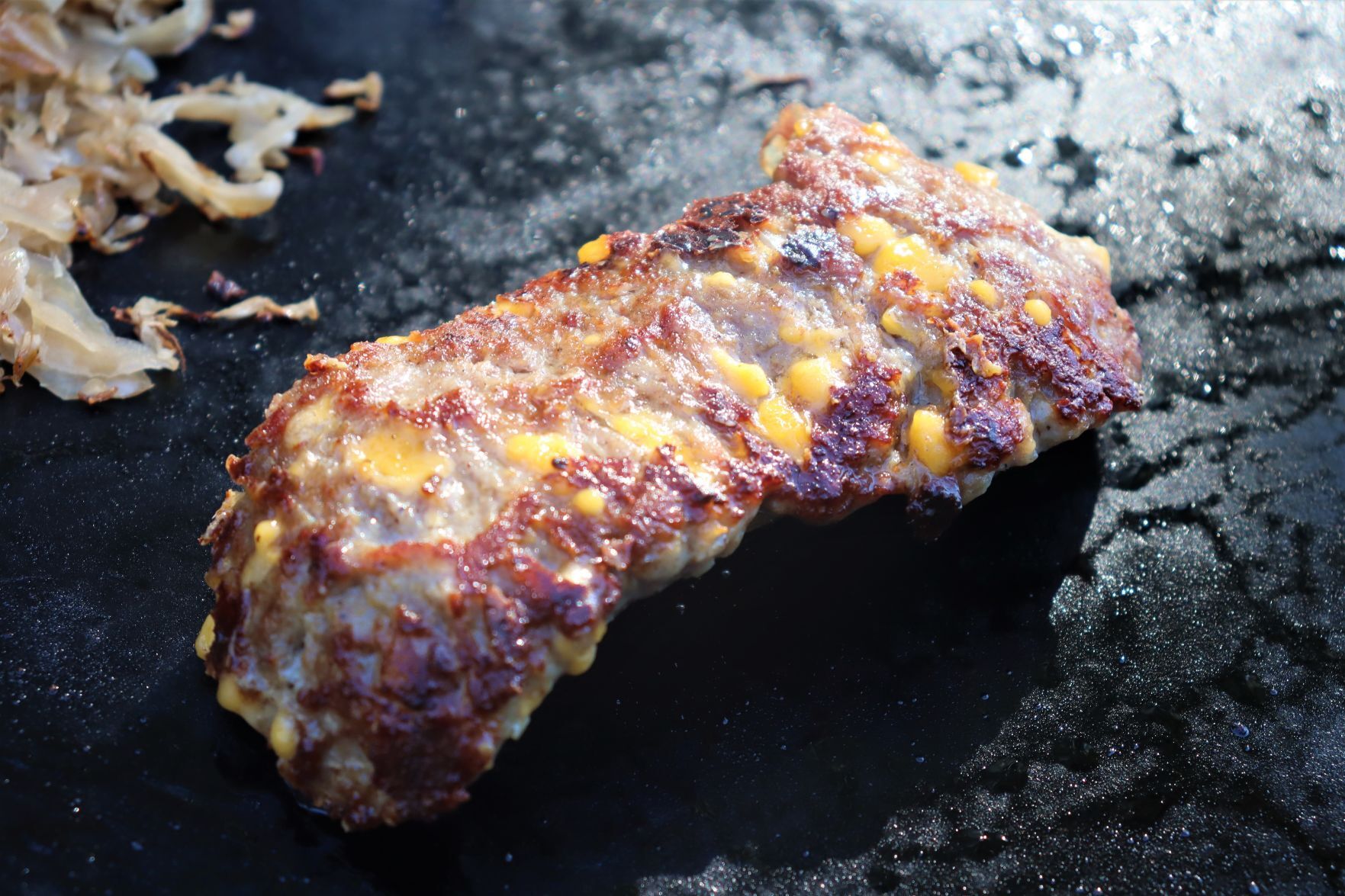 Blake Sykora preparing a Wisconsin cheese steak